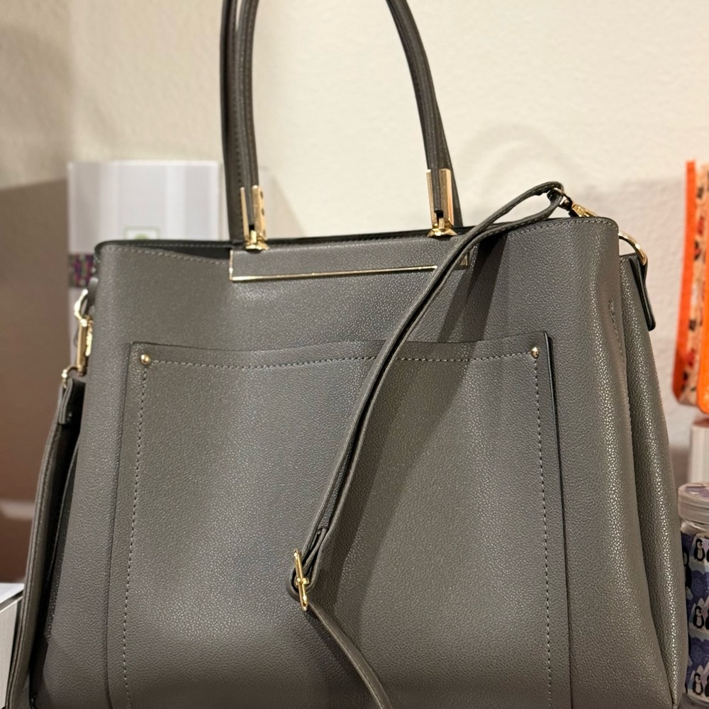 Gray and Gold Satchel with Structured Design and Versatile Strap